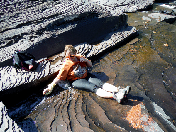 Karen Duquette cooling off in the waters of Manido Falls